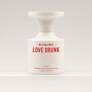 Perfume bottle labeled 'LOVE DRUNK' by BLA BLI BLU on a white background