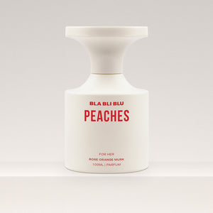 Perfume bottle labeled 'PEACHES' by BLA BLU on a white background