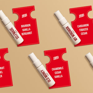 White spray bottles with red labels on a beige background