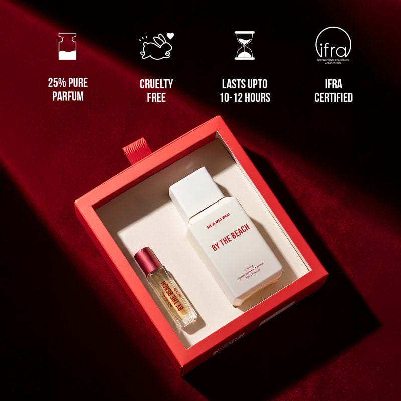 Perfume set with a red box, featuring a bottle and a small vial.