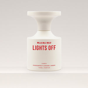 Perfume bottle labeled 'BLA BLI BLU LIGHTS OFF' on a white background