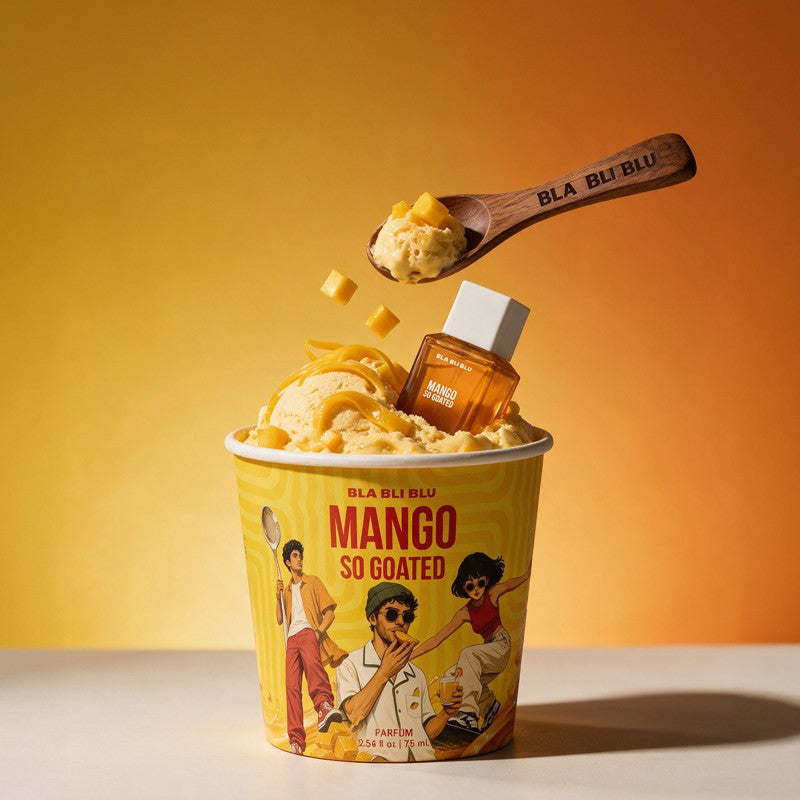 A cup of BLA BLA BLU Mango So Coated fragrance topped with mango ice cream, a wooden spoon with mango pieces.