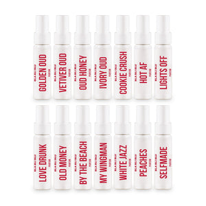 Set of 15 small perfume bottles with red text on a white background
