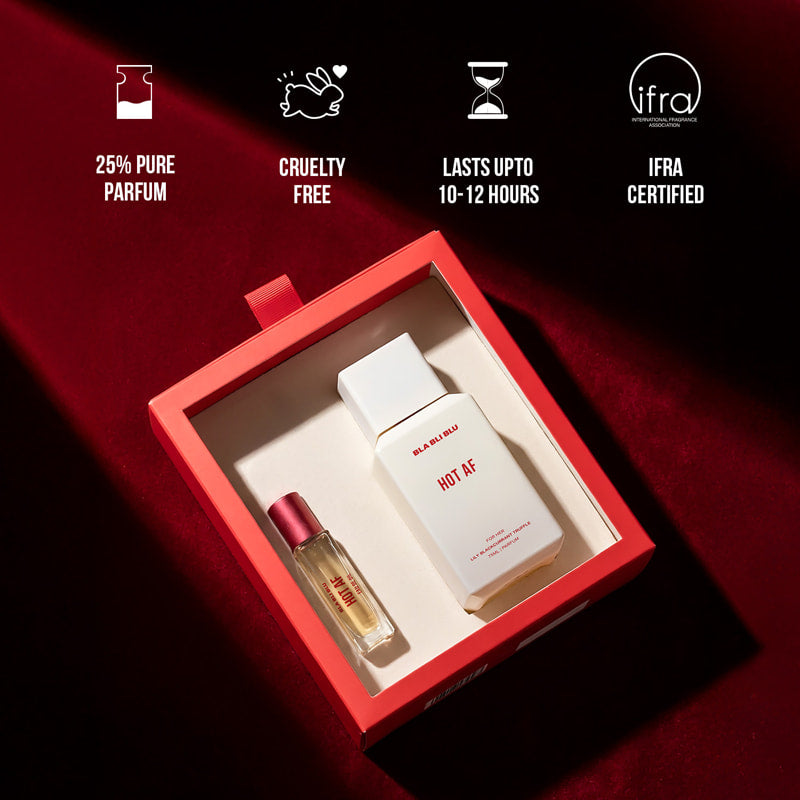 Perfume set with two bottles in a red box on a dark background.