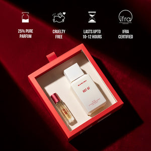 Perfume set with two bottles in a red box on a dark background.