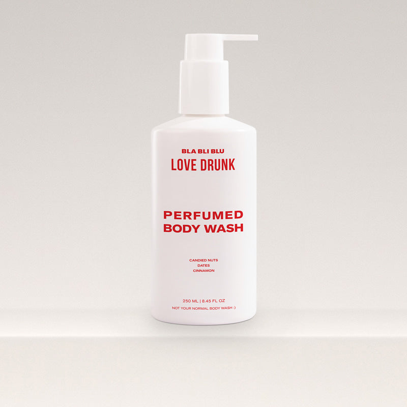 Perfumed body wash bottle with pump on a light gray background