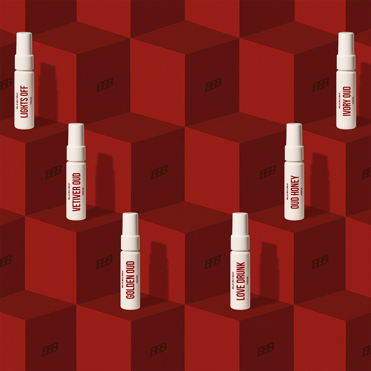 White spray bottles with text on a red geometric patterned background