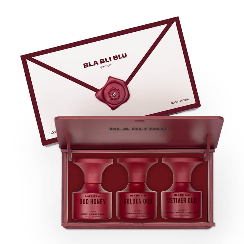 Red cosmetic set with 'BLA BLI BLU' branding on a white background