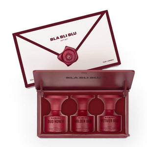 Red cosmetic set with 'BLA BLI BLU' branding on a white background