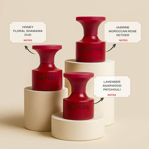 Three red bottles labeled with notes on a beige background