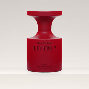 Red oud honey unisex perfume bottle labeled by BLA BLI BLU on a white background